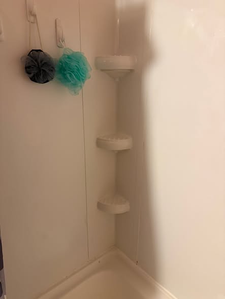 The same shower corner after cleaning by The Clean Nest
