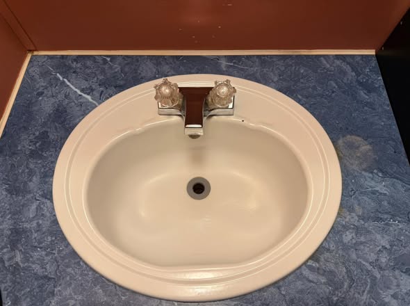 The same bathroom sink after cleaning by The Clean Nest