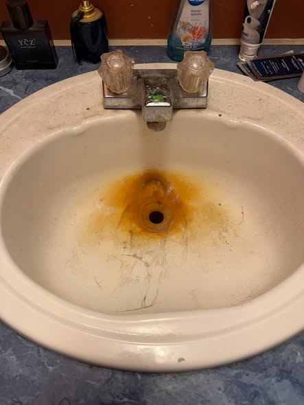 Bathroom sink before cleaning by The Clean Nest